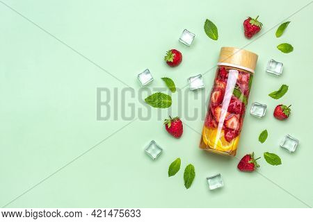 Strawberry Infused Water, Cocktail, Lemonade Or Tea. Summer Iced Cold Drink With Strawberry, Lemon A