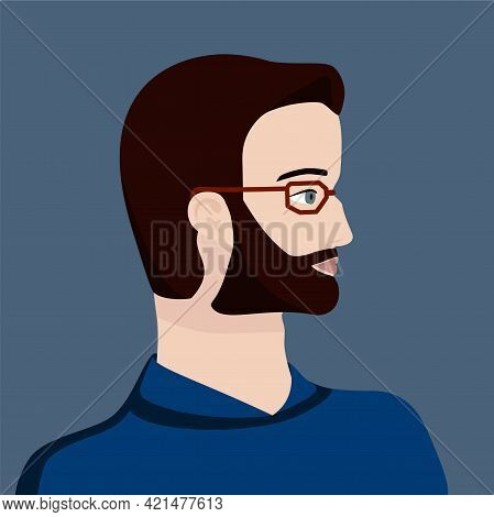 Portrait Of A Dark Haired Man With Glasses In Blue Sweter. The Head Of A European Young Man In Profi