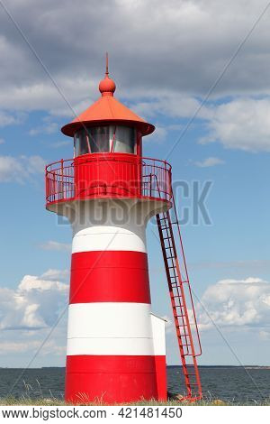 The Red And White Lighthouse Of Oddesund In Denmark