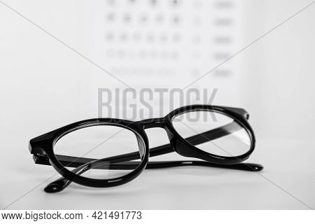 Glasses On Light Background, Closeup. Ophthalmologist Prescription