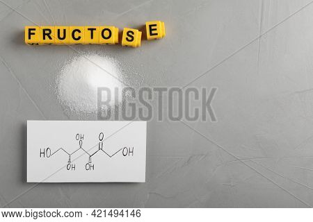 Word Fructose Made Of Yellow Cubes, Sugar And Paper With Scheme On Grey Table, Flat Lay. Space For T