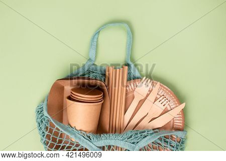 Top View On Eco-friendly Tableware - Kraft Paper Food Cups And Containers With Wooden Cutlery In Blu