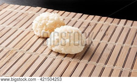 Cocada, Coconut Candy From Brazil, White Cocadas On Wooden Mat, Black Background, Selective Focus.