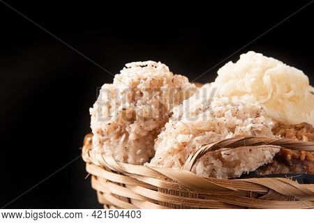 Cocada, Coconut Candy From Brazil, White And Brown Cocadas In A Straw Basket On Dark Surface, Black
