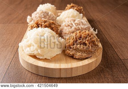 Cocada, Coconut Candy From Brazil, White And Brown Cocadas On Wooden Surface, Black Background, Sele
