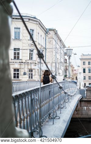 Saint-petersburg, Russia, 28 August 2020: An Unrecognizable Young Girl With An Umbrella Crosses The 