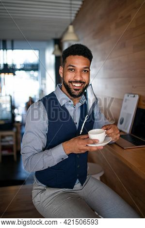 Businessman With Coffee Working In Cafe, Freelance Work And Coronavirus Concept.