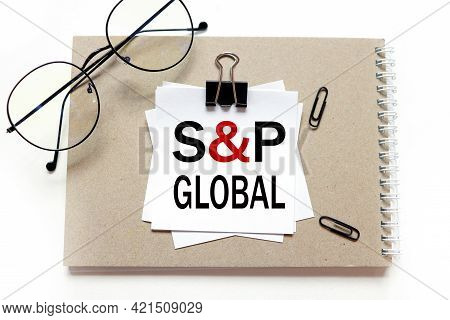 S And P Global. Stickers On Notepad, Text On White Sticker On White Background