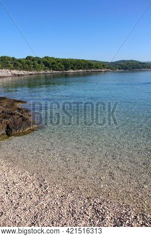 Turquoise Sea Water White Stone Beach And Mountains, Sumartin, Brac Island, Croatia