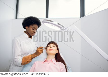 Bio Revitalization And Oxygen Peeling Therapy. Young Lady In The Beauty Salon During Rejuvenation Pr