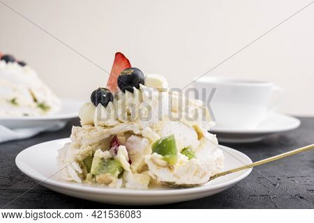 Mereng Cake With Fresh Berries And Fruits. Strawberries, Kiwi, Blackberries. Protein Dessert In Whit