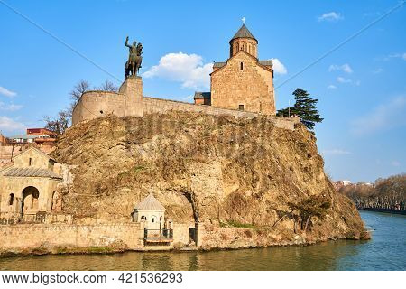 Metekhi Church And The Equestrian Statue Of King Vakhtang Gorgasali In Tbilisi. Tbilisi, Georgia - 0
