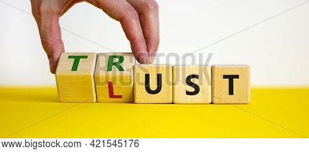 Lust Or Trust Symbol. Businessman Turns Wooden Cubes And Changes The Words 'lust' To 'trust'. Beauti