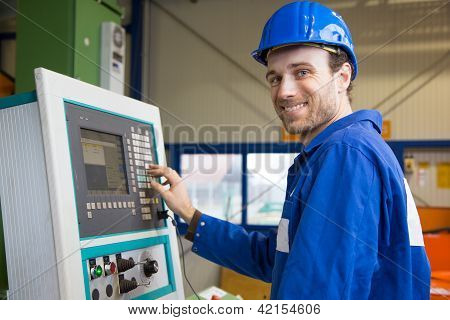 Construction Worker Operating A Machine