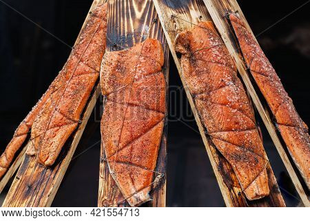 Fillet Of Wild Salmon With Salt And On Cedar Planks. Cooking On The Bbq