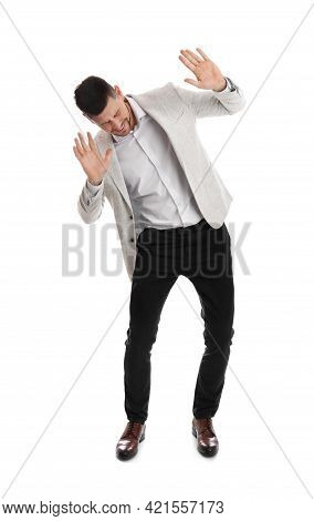 Emotional Man Evading Something On White Background