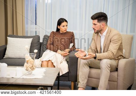 Young Married Couple Wife And Husband Discussing Misunderstandings In Their Relationships Considerin