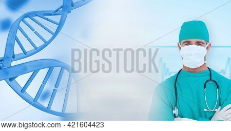 Composition of caucasian male doctor and dna strand with motion blur. medical science and technology concept digitally generated image.