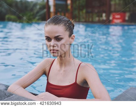Pretty Woman Leaning On The Overlords Tile And Red Swimsuit Wet Hair Relax Vacation
