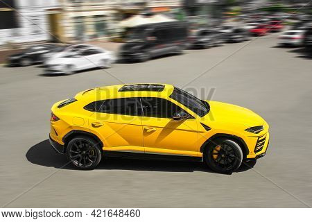 Kiev, Ukraine - May 22, 2021: Yellow Luxury Super Suv Lamborghini Urus In Motion. Lamborghini Urus S