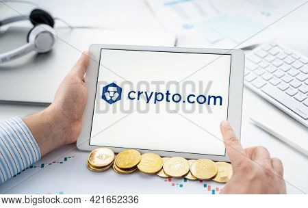 Russia Moscow 06.05.2021.businessman With Tablet.logo Of Cryptocurrency Stock Exchange Crypto.com.tr
