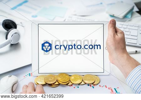 Russia Moscow 06.05.2021.businessman With Tablet.logo Of Cryptocurrency Stock Exchange Crypto.com.tr