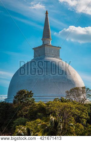 Mahaseya Dagoba ancient Buddhist stupe in Mihintale, Sri Lanka, on sunset