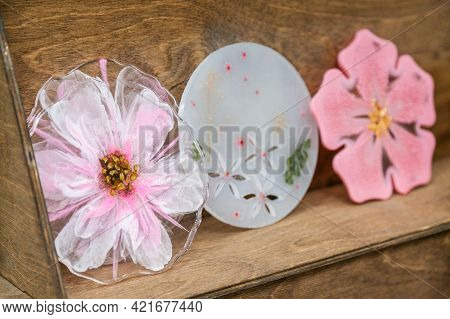 The Pink Coasters Is Made Of Epoxy Resin. Stand, Tray, Or Decorative Element On Wooden Shelf.