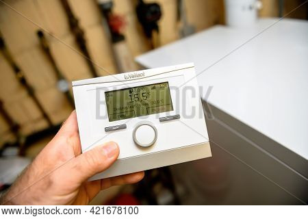 London, United Kingdom - Apr 7, 2021: Pov Male Hand Holding Vaillant Vrc 700 Heating Control Complet