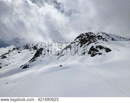 Ski Mountaineering In The Beautiful Swiss Alps. Winter Landscape In The Grisons Mountains Near The E