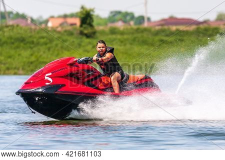 Krasnodar, Russia - July 25, 2020: Brabus Jet Ski Watercraft Boy Driver Drives Water Bike At High Sp