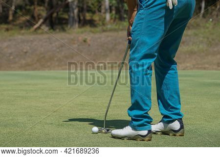 Golfers Are Putting Golf In The Evening Golf Course Golf Backglound. Golfer Hitting Golf Ball. Sport