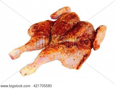 Raw Spatchcock Chicken With Piri Piri Seasoning Isolated On A White Background