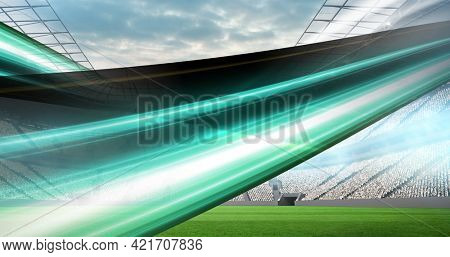 Composition of green trails over sports stadium. sport event and competition concept digitally generated image.