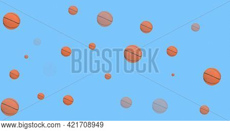 Composition of multiple basketballs over blue background. sport event and competition concept digitally generated image.