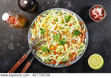 Coleslow Cabbage Salad With Carrot On Grey Kitchen Table. Top View, Copy Space