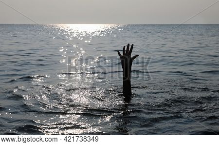 Dramatic Scene With The Open Hand Of The Unfortunate Castaway Who Is About To Drown In The Middle Of