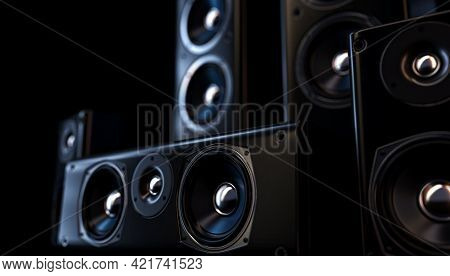 A Modern Surround Sound Speaker Arrangment On A Dark Backlit Studio Background - 3d Render