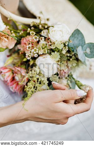 Woman with a woven bag full of flowers