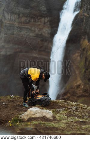 Photographer at the Haifoss waterfall, Iceland