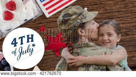 Composition of fourth of july text with female soldier holding her daughter and american flag. independence day celebration, tradition and patriotism concept digitally generated image.
