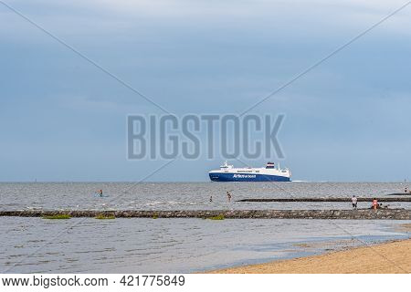 Cuxhaven, Germany - May 6, 2019: Cargo Ship Airbus On Board Passing Cuxhaven Beach Leaving Hamburg O
