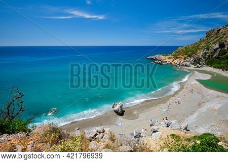 View of Preveli beach on Crete island with relaxing people and Mediterranean sea. Crete island, Greece