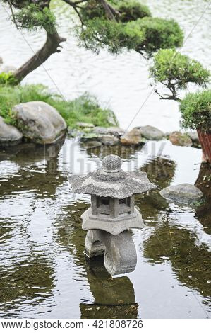 Rankei-gata Stone Lantern On The Lake Shore Of The Japanese Garden In Buenos Aires, Argentina.