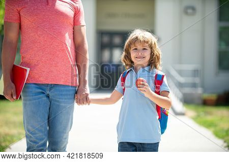 Kid Elementary Student Carrying Backpacks Holding Parent Fathers Hand Walking Up Educational Buildin