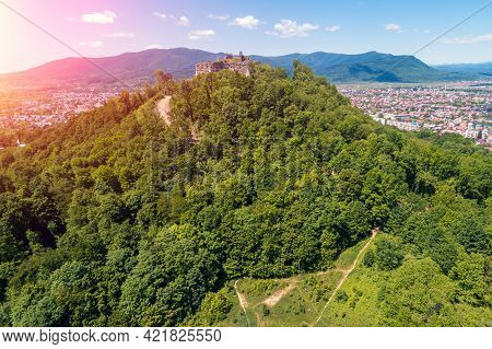 Panoramic View Of Ruins Of Khust Castle On The Mount And Mountain Valley With Khust City. View From 