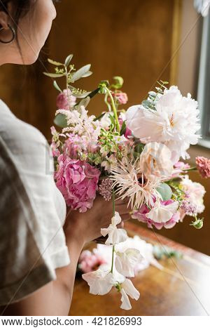 Woman holding a bouquet of flowers