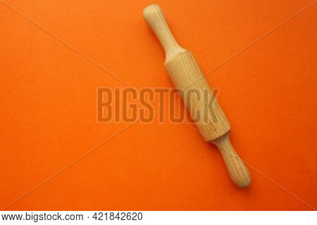 A Rock For A Test Of Wood On An Orange Background. Cooking And Baking. Cookery. View From Above. Cop