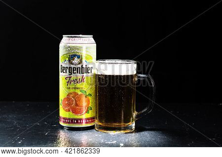 Can Of Bergenbier Beer And Beer Glass On Dark Background. Illustrative Editorial Photo Shot In Bucha