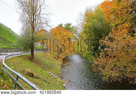 Trees With Multicolored Leaves In The Park. Beautiful Romantic Alley In A Park With Colorful Trees A